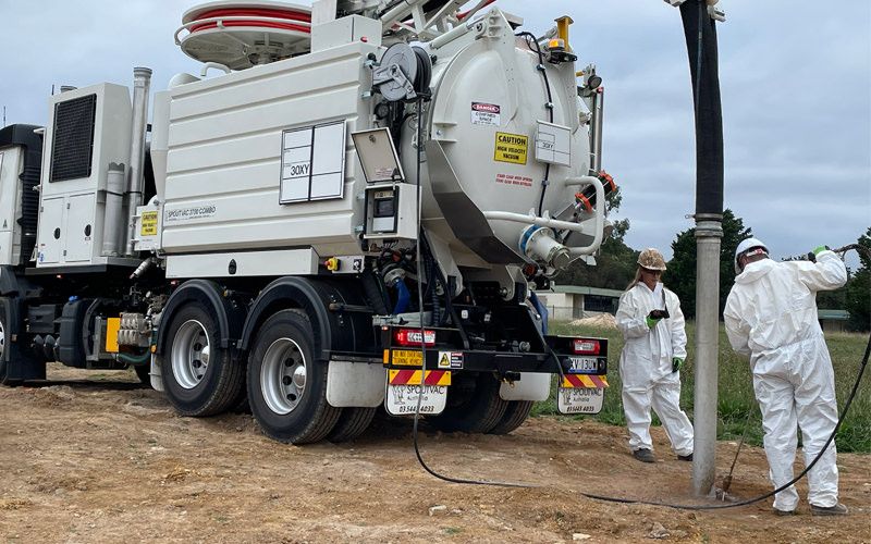 Femal and male employee operating the NDD truck