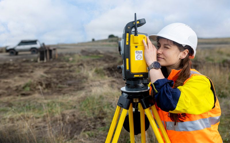 Female Surveyor taking readings