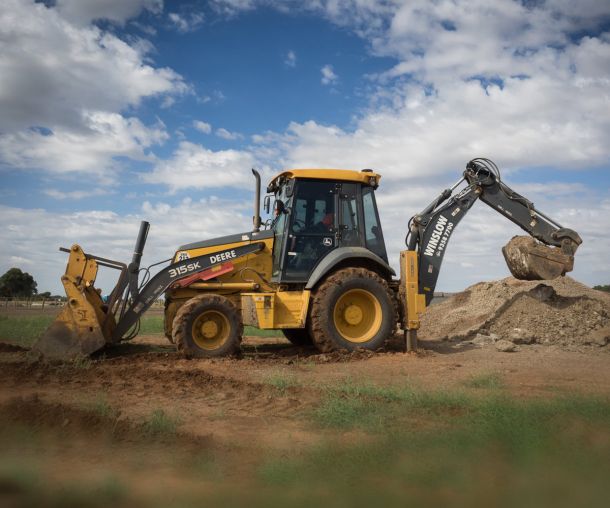 back hoe collecting soil